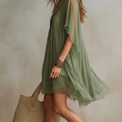 Green layered boho mini dress with tiered floaty silhouette and relaxed fit