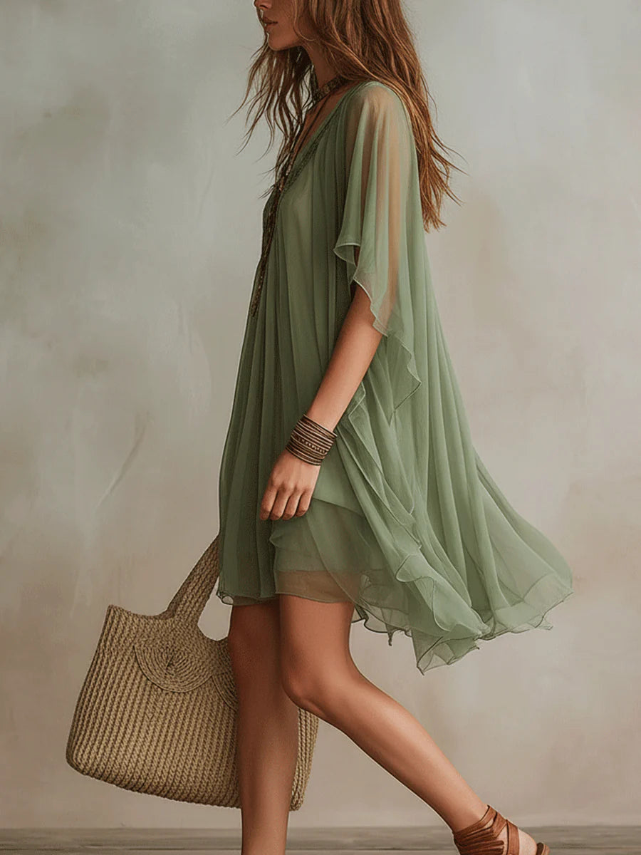 Green layered boho mini dress with tiered floaty silhouette and relaxed fit