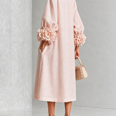 Liliana floral midi dress with round neckline, three-quarter sleeves and rose-knot cuffs