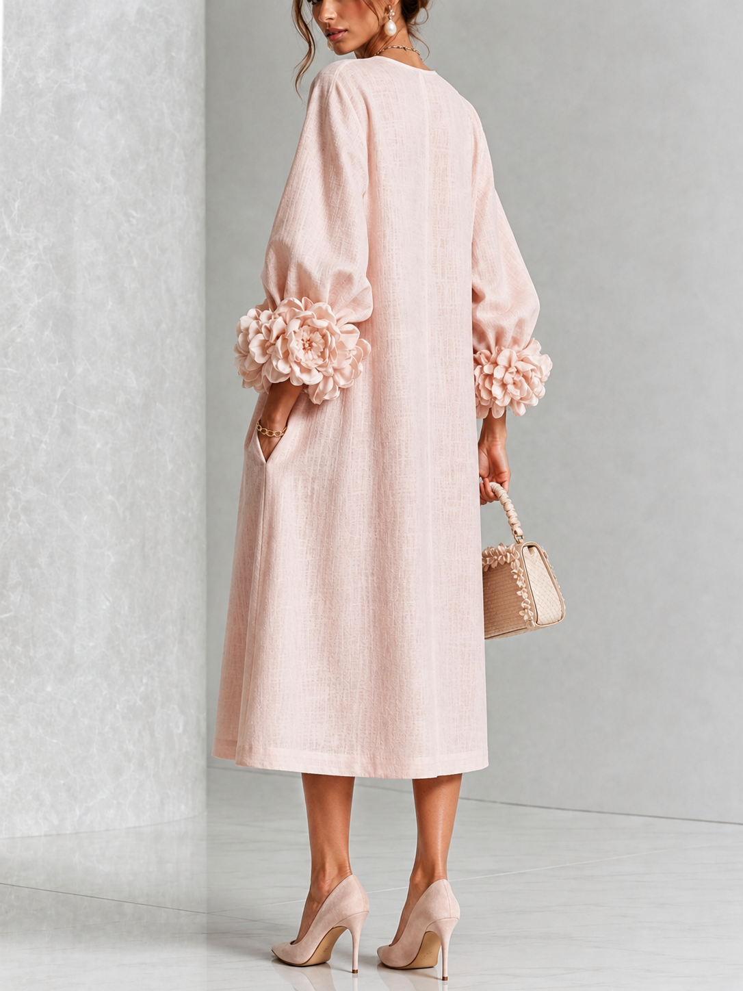 Liliana floral midi dress with round neckline, three-quarter sleeves and rose-knot cuffs