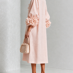 Liliana floral midi dress with round neckline, three-quarter sleeves and rose-knot cuffs