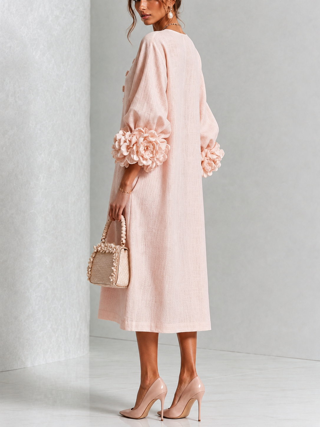 Liliana floral midi dress with round neckline, three-quarter sleeves and rose-knot cuffs