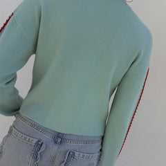 Light blue women's button-front cardigan with a bold octopus pattern across the front and sleeves