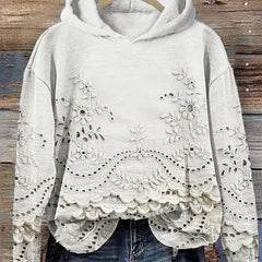 Women's floral eyelet pullover hoodie with structured hood and scalloped hem