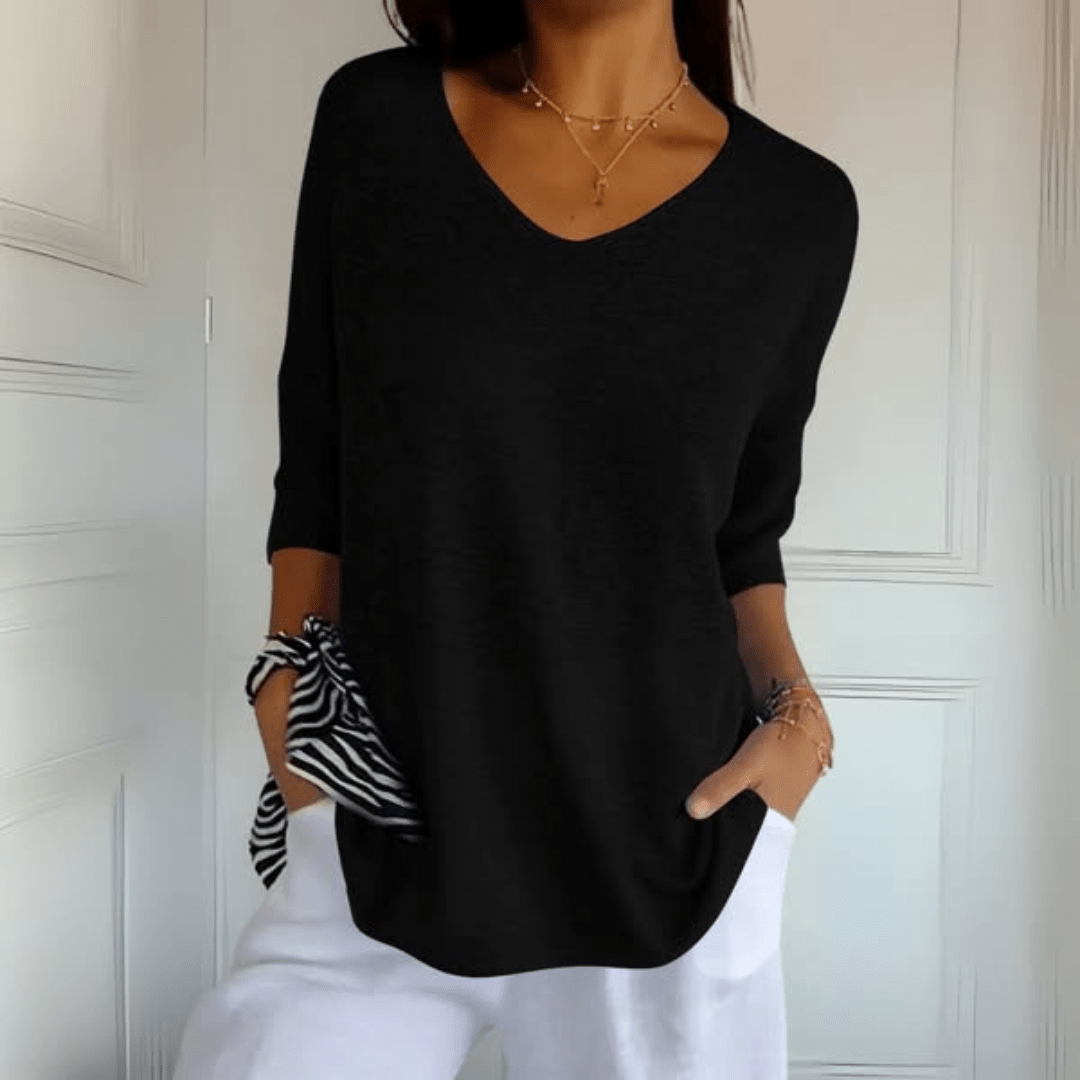 Women's V-neck sweater with a loose, relaxed silhouette shown in multiple colours