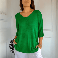 Women's V-neck sweater with a loose, relaxed silhouette shown in multiple colours
