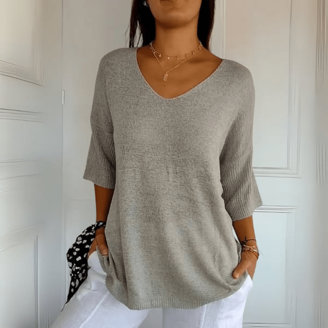 Women's V-neck sweater with a loose, relaxed silhouette shown in multiple colours