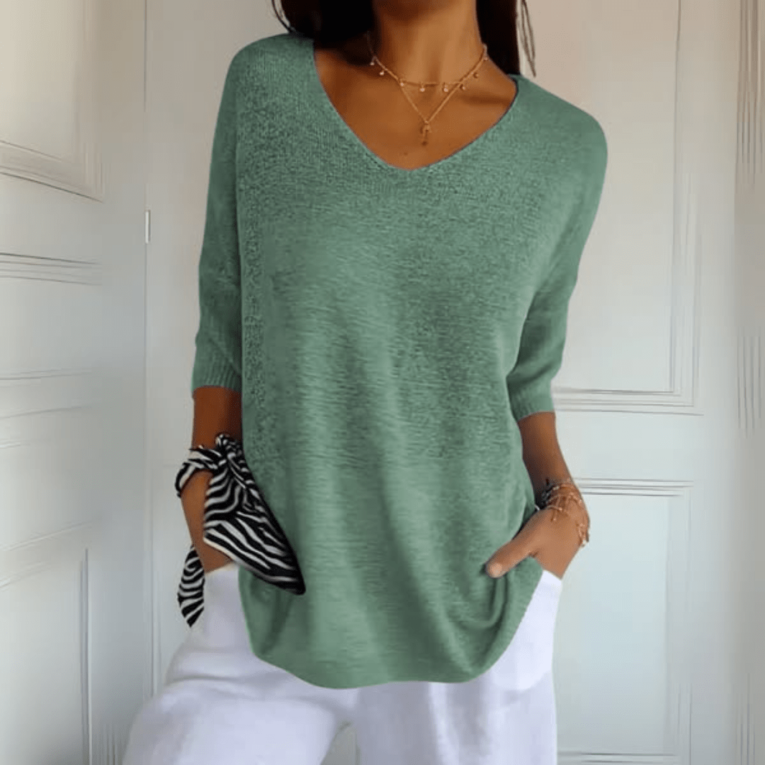 Women's V-neck sweater with a loose, relaxed silhouette shown in multiple colours