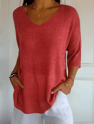 Women's V-neck sweater with a loose, relaxed silhouette shown in multiple colours