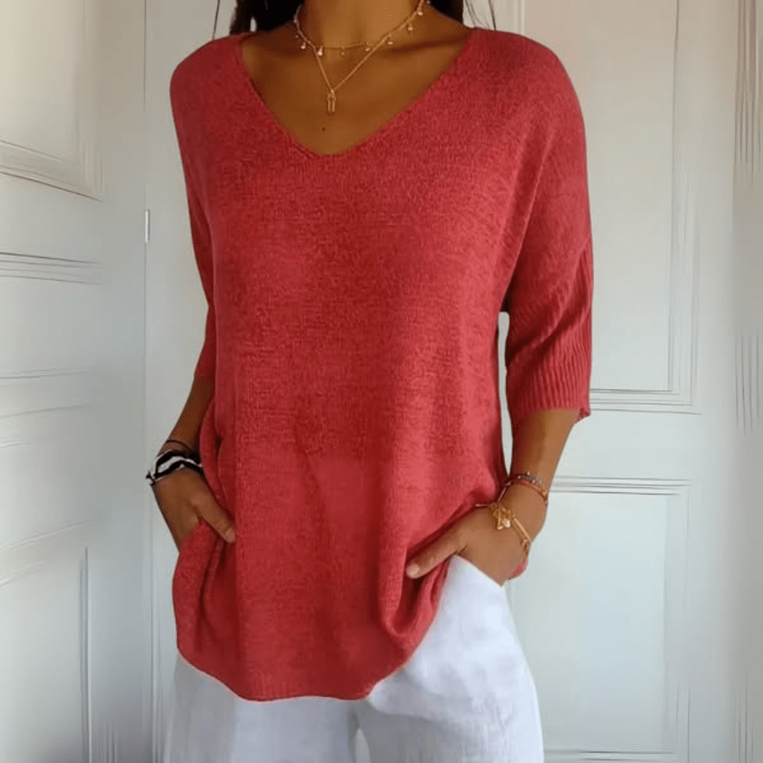 Women's V-neck sweater with a loose, relaxed silhouette shown in multiple colours