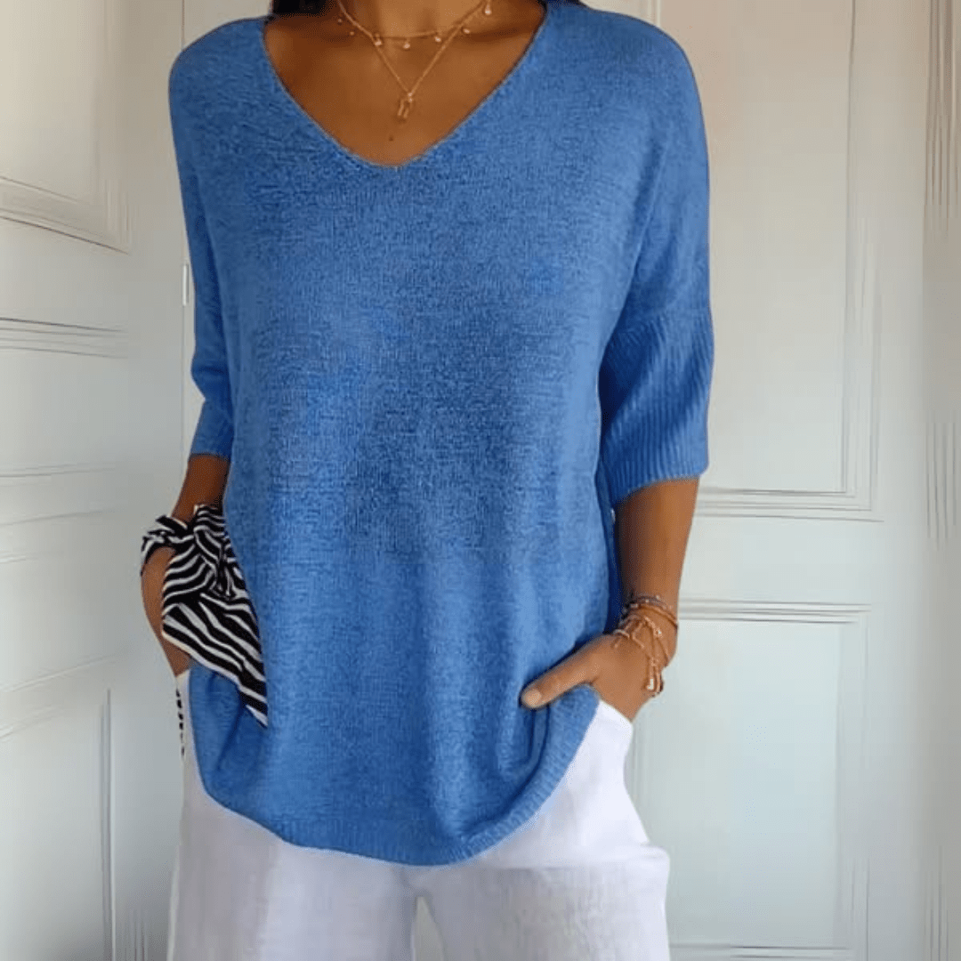 Women's V-neck sweater with a loose, relaxed silhouette shown in multiple colours