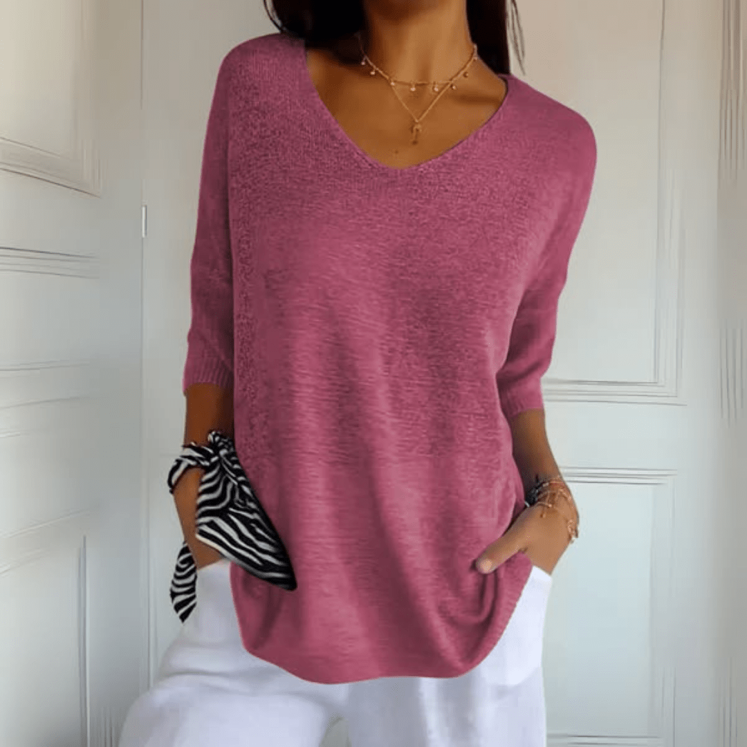 Women's V-neck sweater with a loose, relaxed silhouette shown in multiple colours