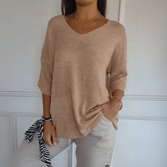 Women's V-neck sweater with a loose, relaxed silhouette shown in multiple colours