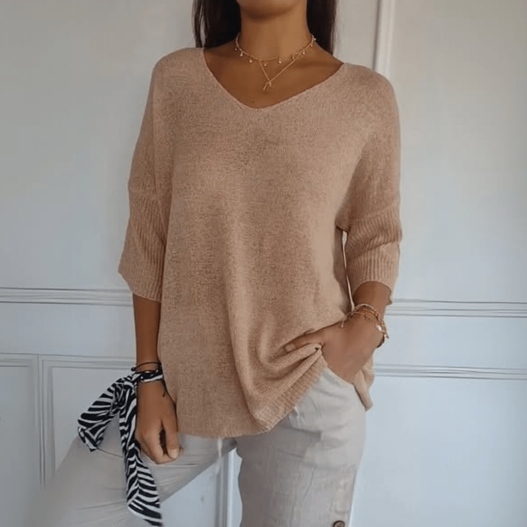 Women's V-neck sweater with a loose, relaxed silhouette shown in multiple colours
