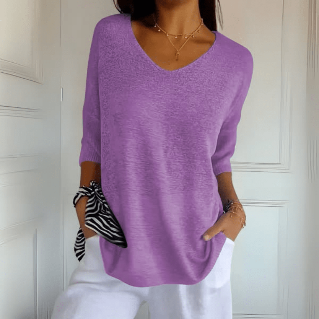 Women's V-neck sweater with a loose, relaxed silhouette shown in multiple colours