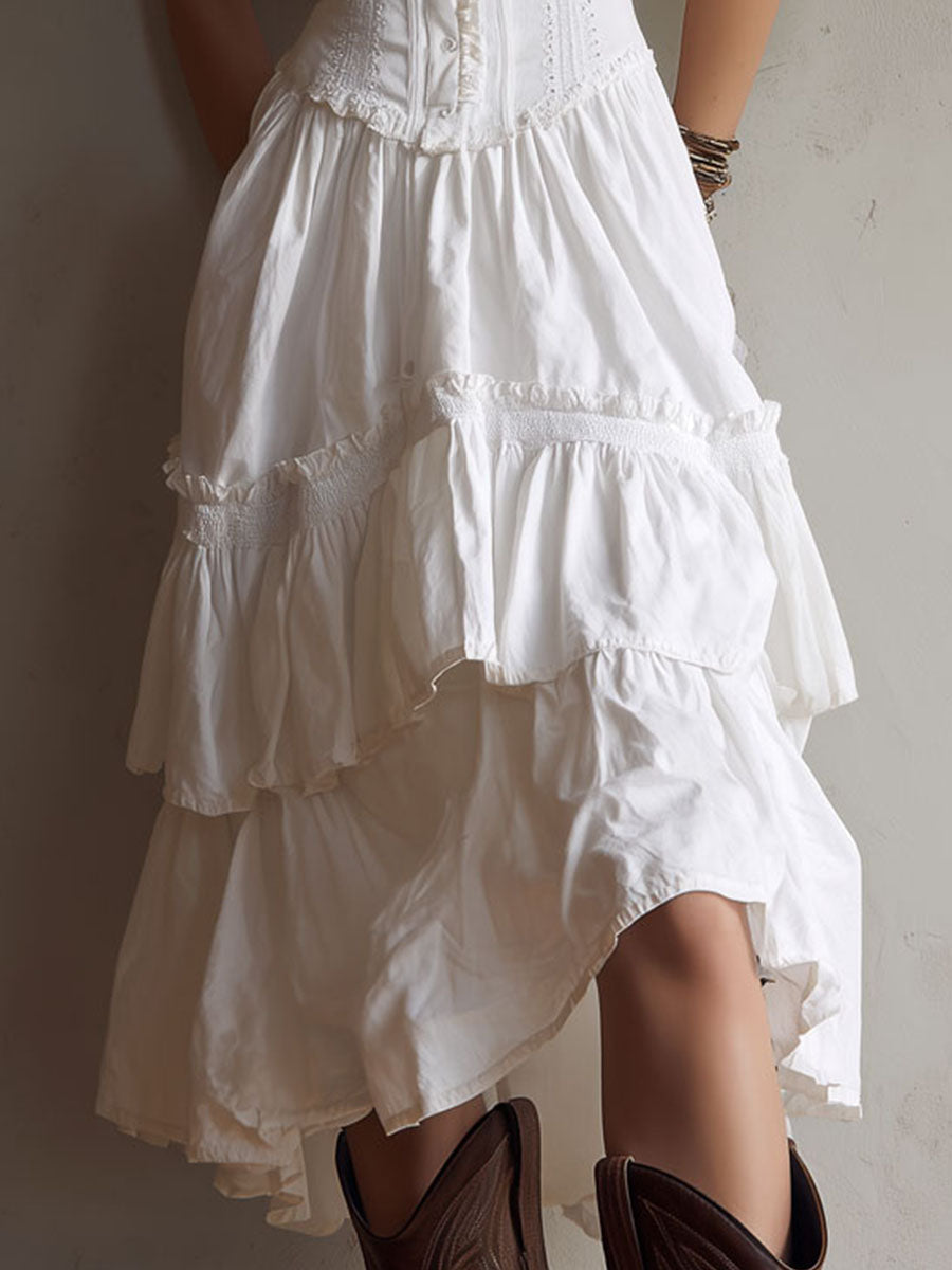 Boho corset midi dress with tiered skirt and delicate lace trim at the neckline