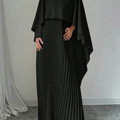 Elegant pleated cape maxi dress with flowing overlay and floor-length skirt