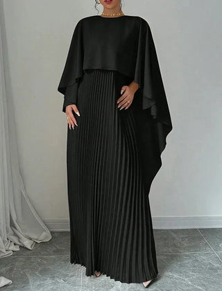 Elegant pleated cape maxi dress with flowing overlay and floor-length skirt
