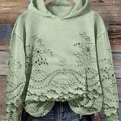 Women's floral eyelet pullover hoodie with structured hood and scalloped hem