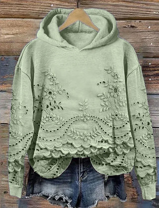 Women's floral eyelet pullover hoodie with structured hood and scalloped hem