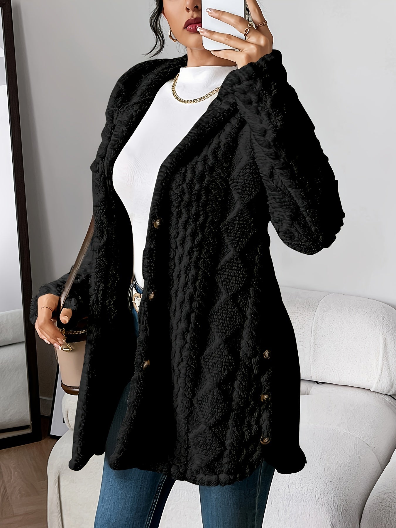 Women's hooded longline cardigan with button-front closure and raised textured surface