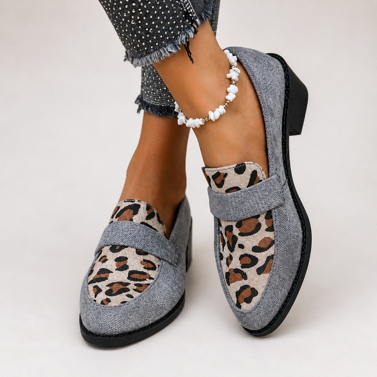 Brunika slip-on loafers in brown, grey and black with a refined, structured design