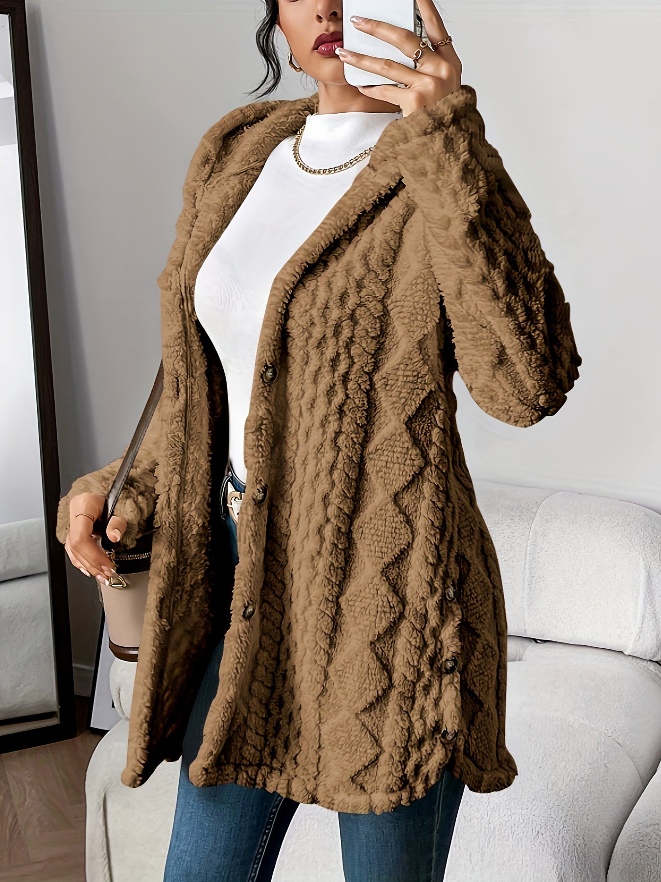 Women's hooded longline cardigan with button-front closure and raised textured surface