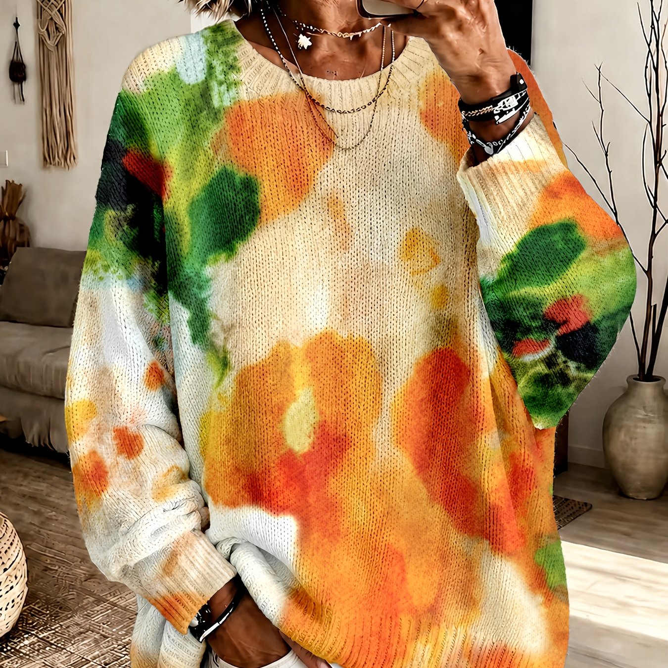 Orange tie-dye floral round-neck sweater with a relaxed fit and long sleeves