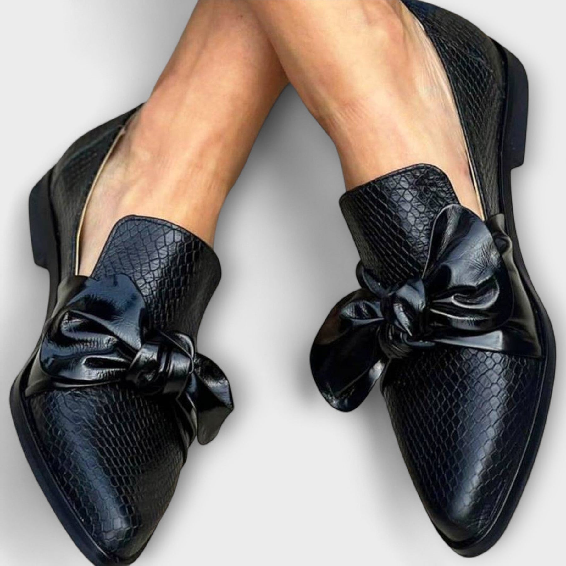 Claudia slip-on loafers with an elegant buckle detail