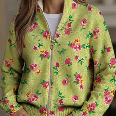 Lime green zip-up bomber cardigan with pink and coral floral print and metal zipper pull
