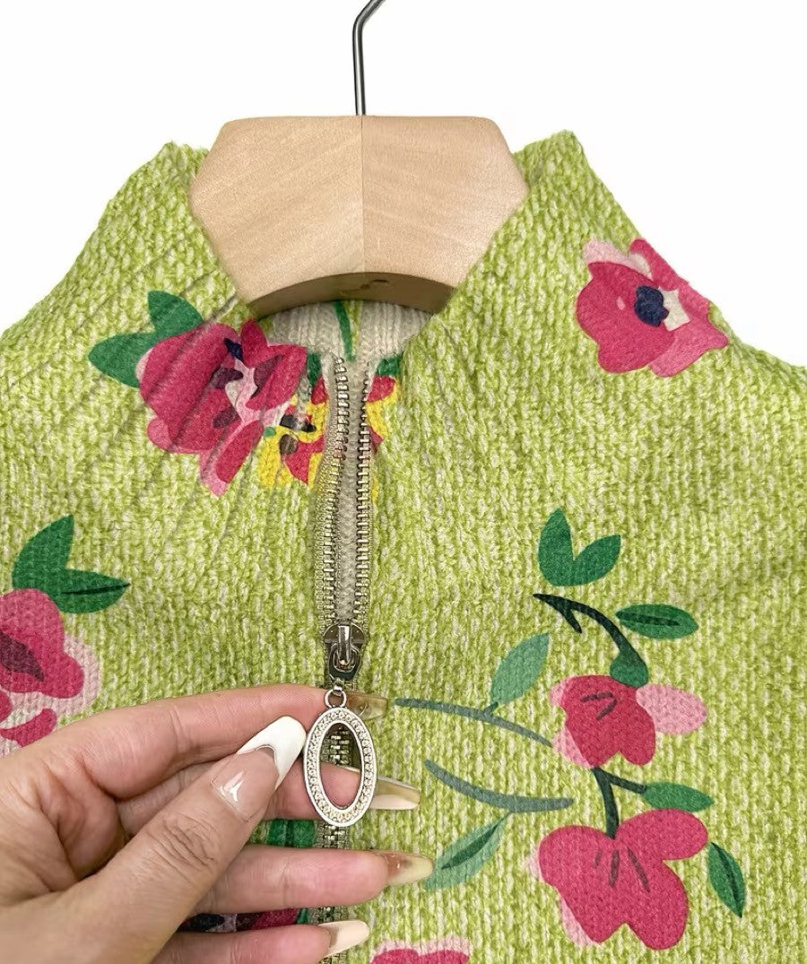 Lime green zip-up bomber cardigan with pink and coral floral print and metal zipper pull