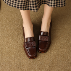 Contessa buckle loafers with square toe and block heel in black and brown
