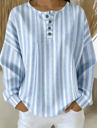 Striped waffle-knit henley collar sweatshirt with buttoned placket and relaxed fit
