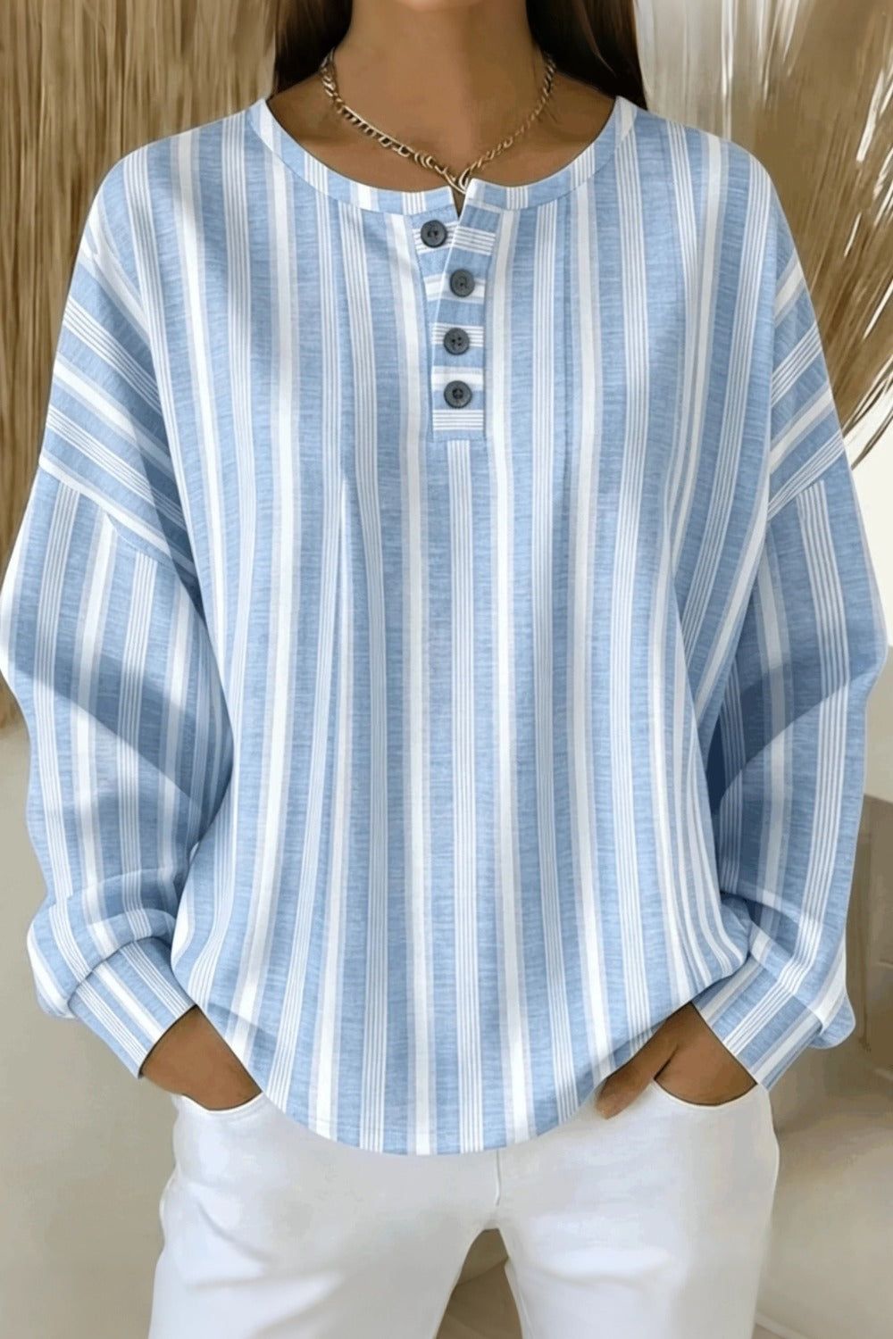Striped waffle-knit henley collar sweatshirt with buttoned placket and relaxed fit