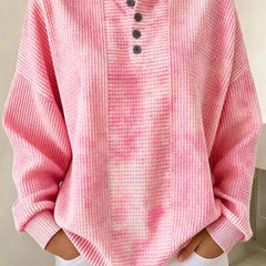 Woman wearing a casual striped waffle-knit sweatshirt with a relaxed fit