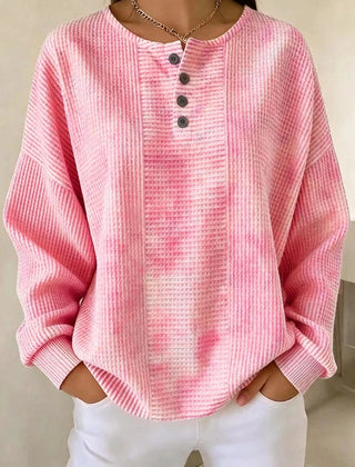 Woman wearing a casual striped waffle-knit sweatshirt with a relaxed fit