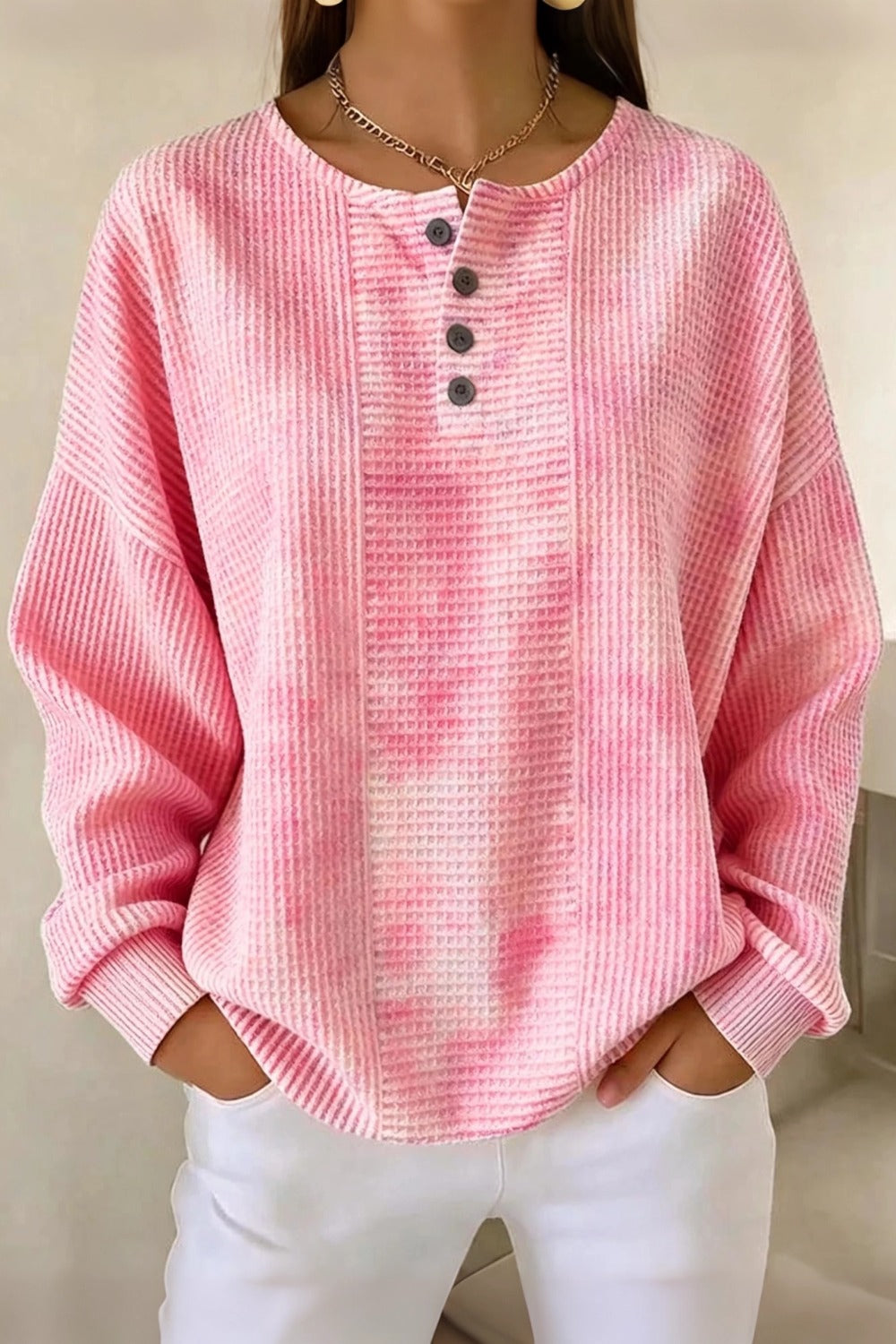 Woman wearing a casual striped waffle-knit sweatshirt with a relaxed fit