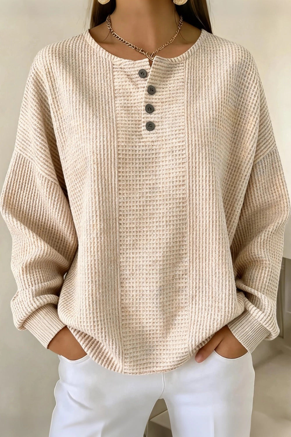 Woman wearing a casual striped waffle-knit sweatshirt with a relaxed fit