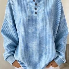 Woman wearing a casual striped waffle-knit sweatshirt with a relaxed fit