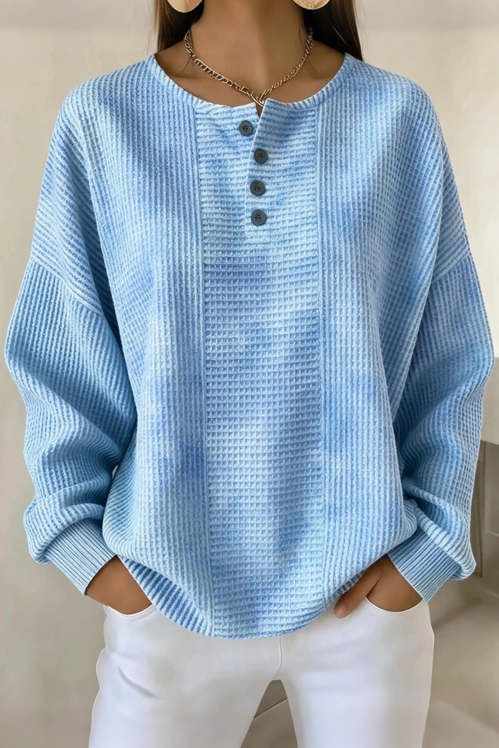 Woman wearing a casual striped waffle-knit sweatshirt with a relaxed fit