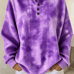 Woman wearing a casual striped waffle-knit sweatshirt with a relaxed fit