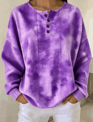 Woman wearing a casual striped waffle-knit sweatshirt with a relaxed fit