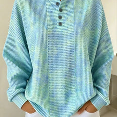 Woman wearing a casual striped waffle-knit sweatshirt with a relaxed fit