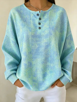 Woman wearing a casual striped waffle-knit sweatshirt with a relaxed fit