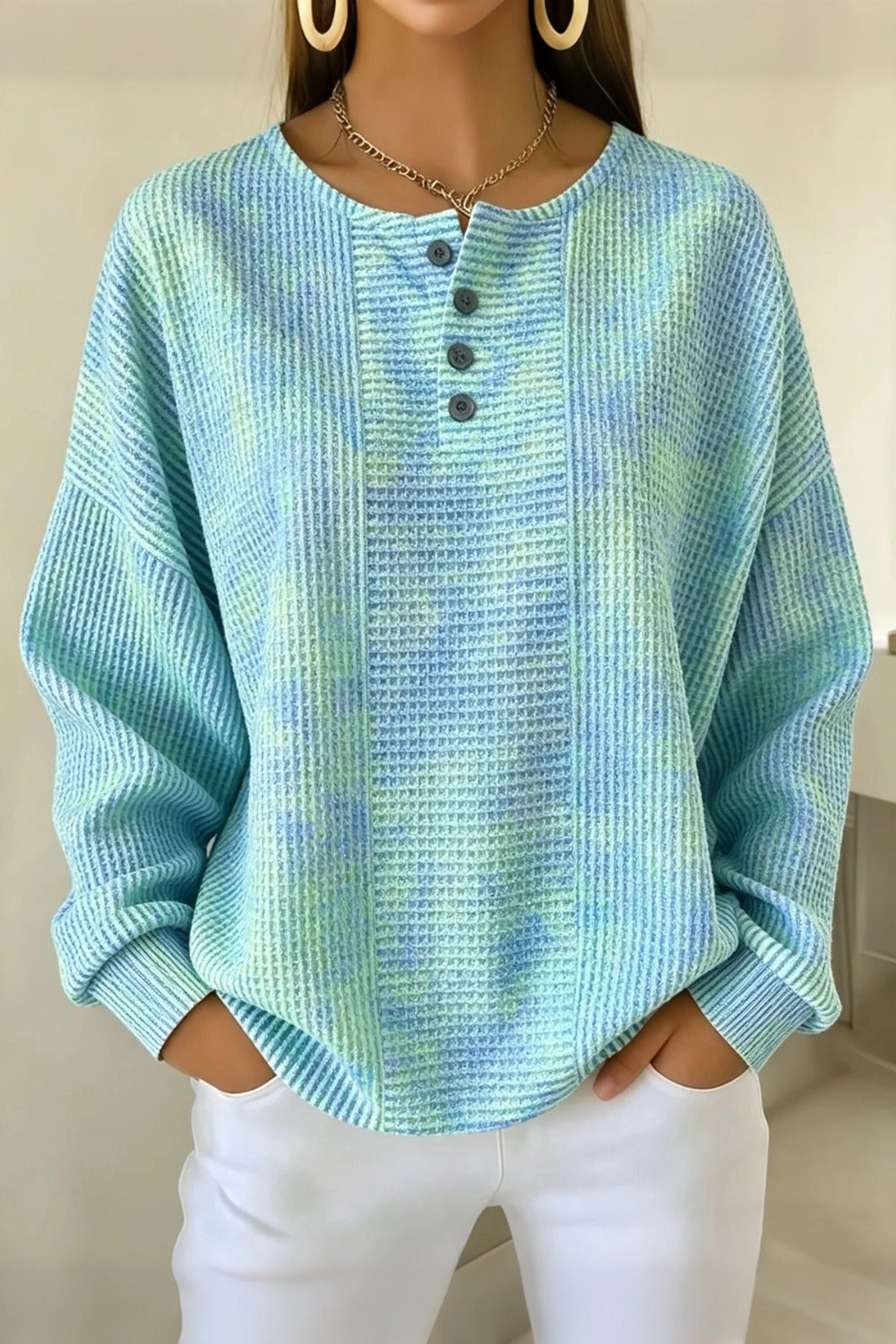 Woman wearing a casual striped waffle-knit sweatshirt with a relaxed fit