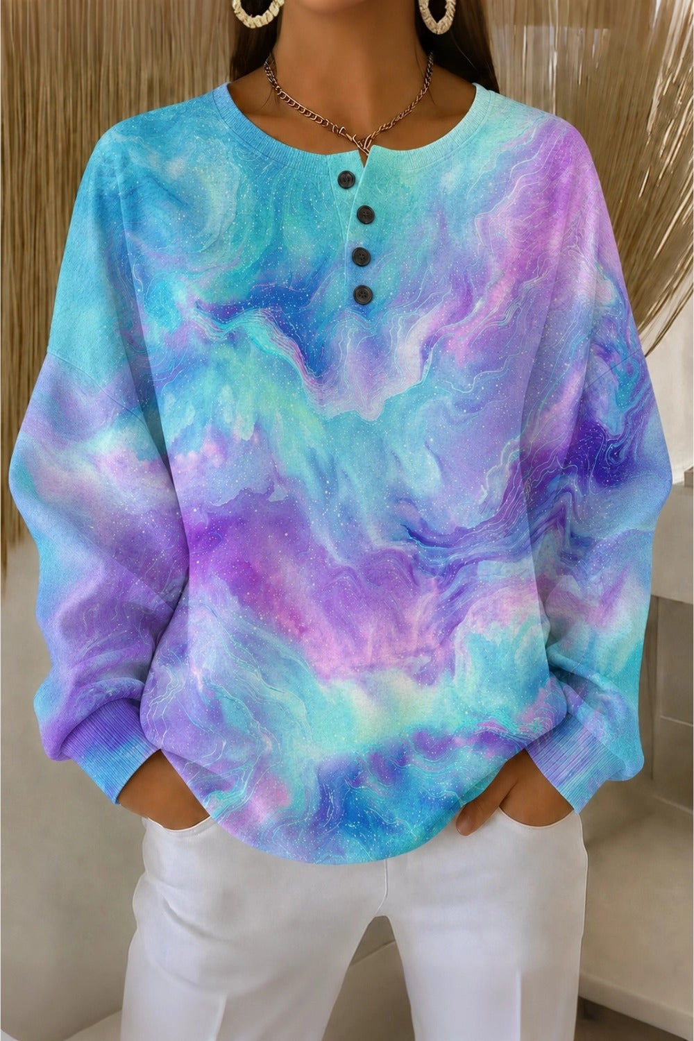 Women's henley collar ombre sweatshirt with buttoned neckline and relaxed fit