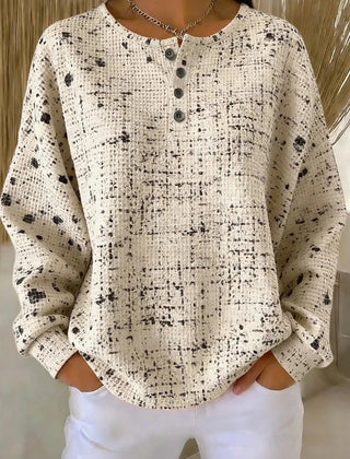 Woman wearing a relaxed waffle knit crew neck sweatshirt in a loose casual fit