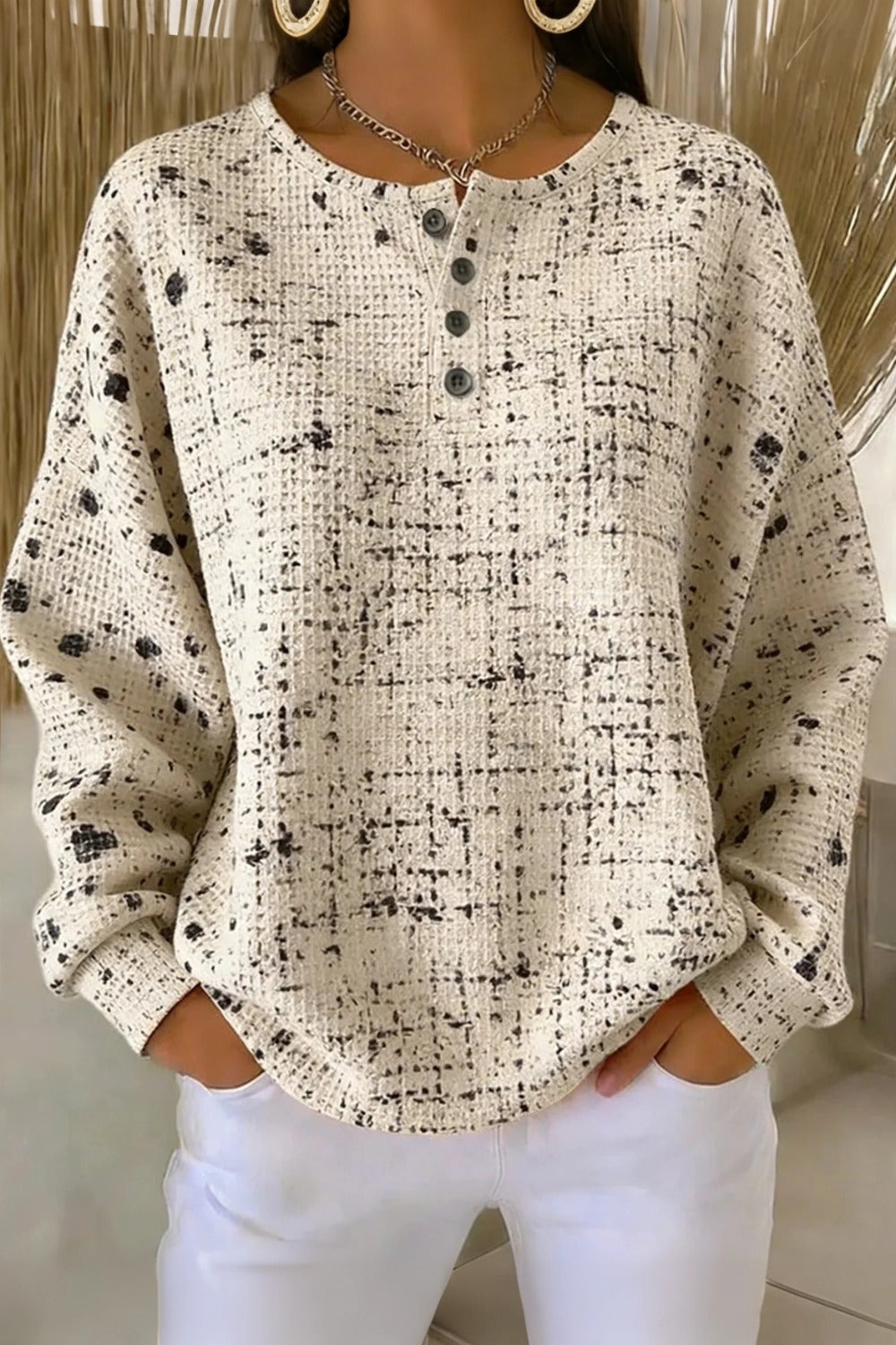 Woman wearing a relaxed waffle knit crew neck sweatshirt in a loose casual fit