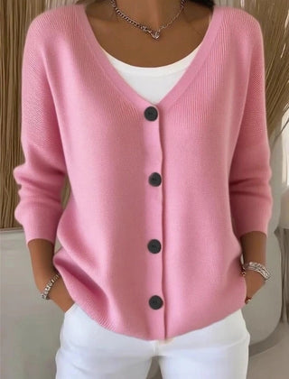 Woman wearing a plain long sleeve loose-fit V-neck casual cardigan