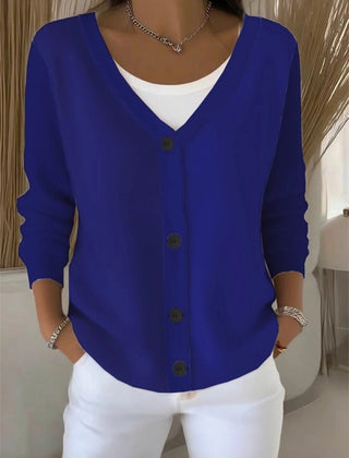 Woman wearing a plain long sleeve loose-fit V-neck casual cardigan